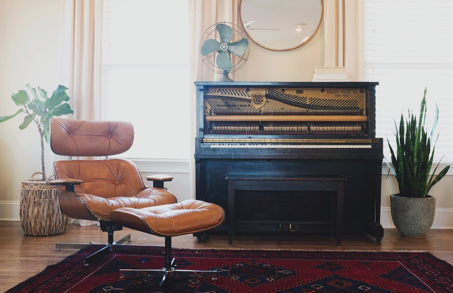 Empty room with a piano and chair, symbolizing a safe space for therapy.